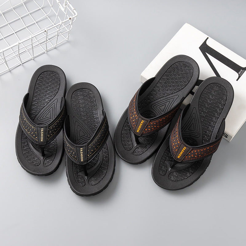 Men's black flip-flop sandals with orange perforated strap detail and textured soles