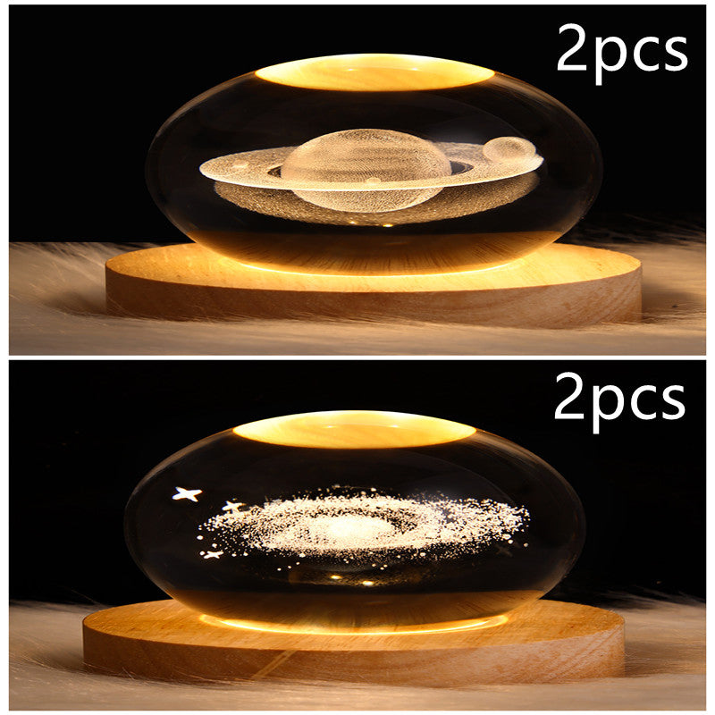 LED galaxy crystal ball lamp with floating planet and glowing ring; wooden base