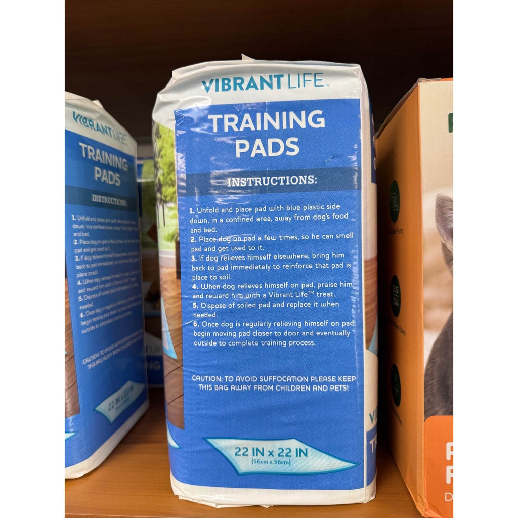 Dog training pads package back with blue instructions and 22 x 22 in size label