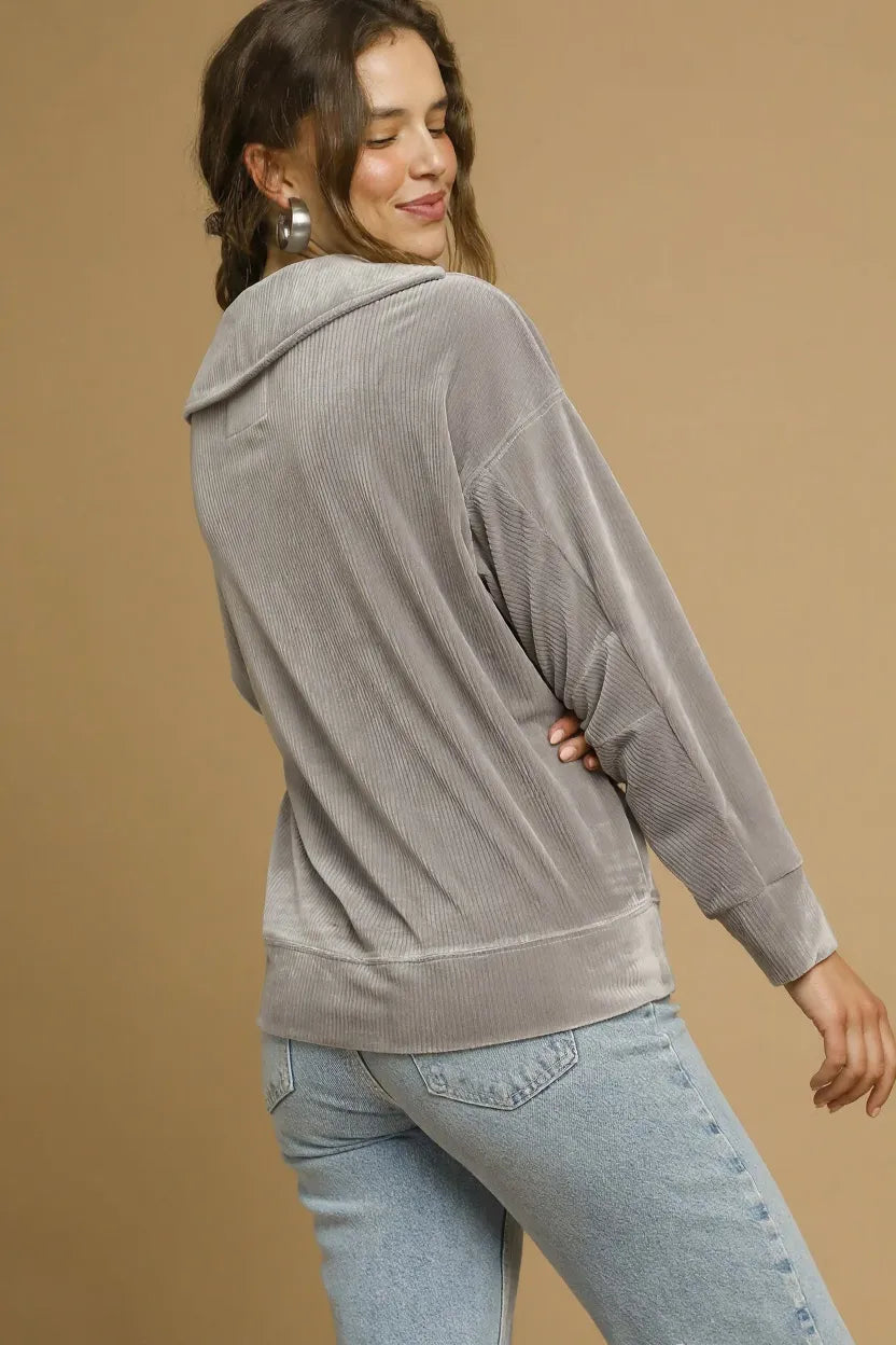 Grey long-sleeve pullover top with relaxed fit and cuffed sleeves