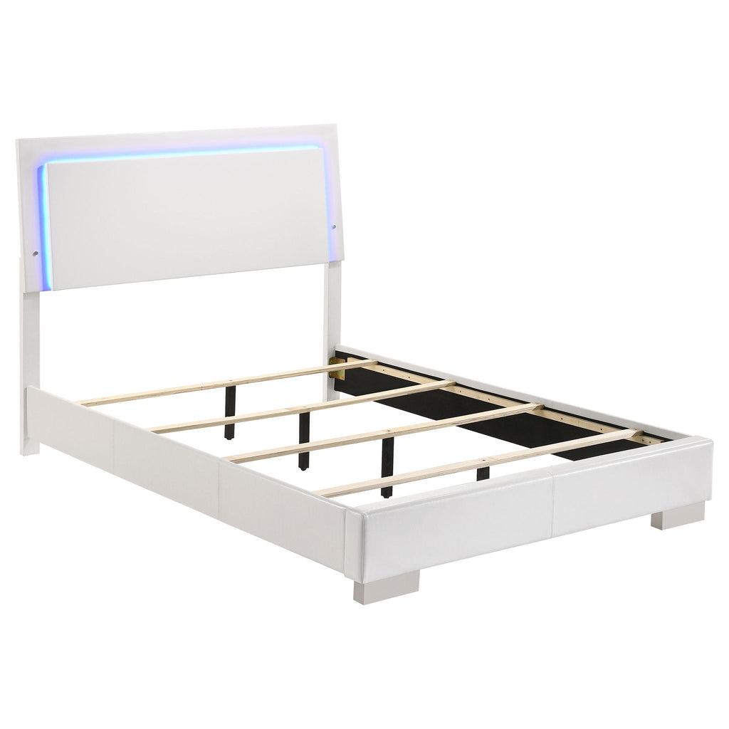 White high-gloss platform bed frame with black slats and padded headboard