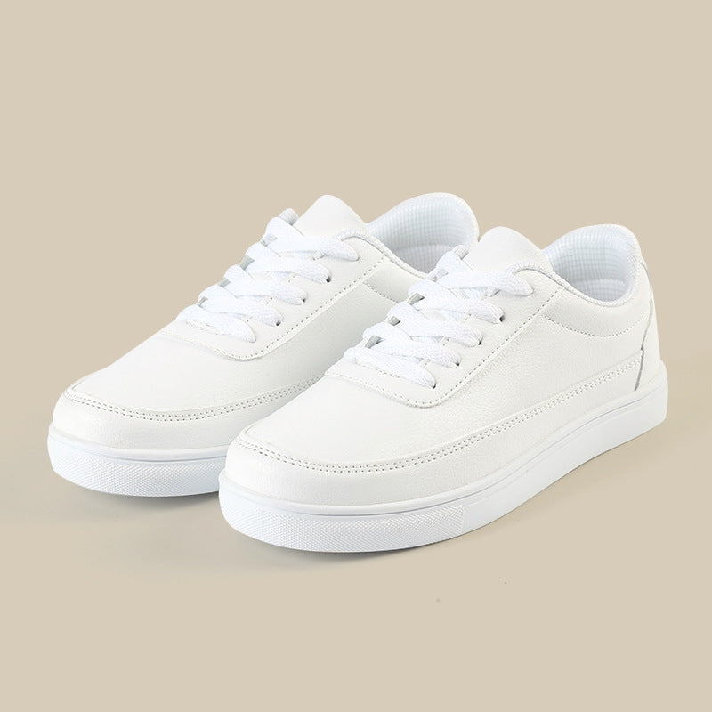 Men's white casual sneakers with lace-up front and low rubber sole