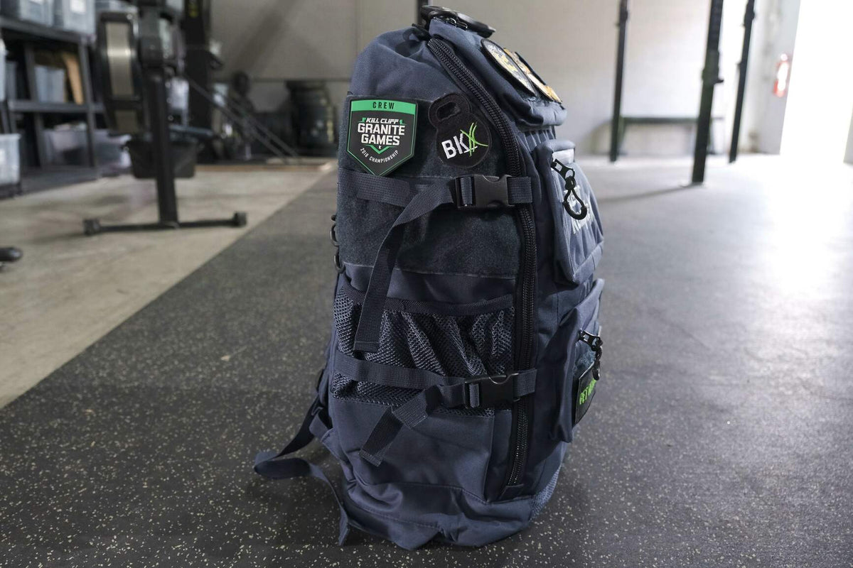 BKX black military backpack, rear view with padded back panel and adjustable straps