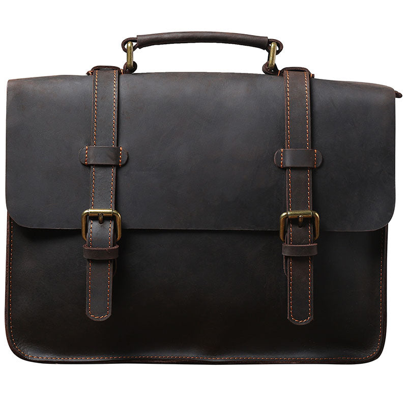 Brown leather briefcase-style messenger bag with front flap and adjustable shoulder strap