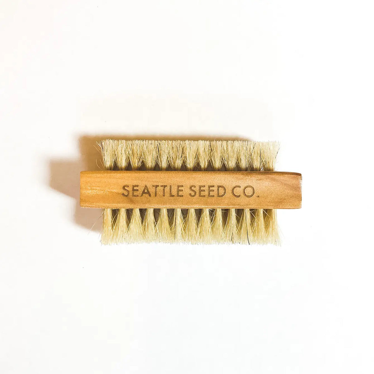 Vegetable and nail brush with wooden handle and yellow bristles, Seattle Seed Co. label