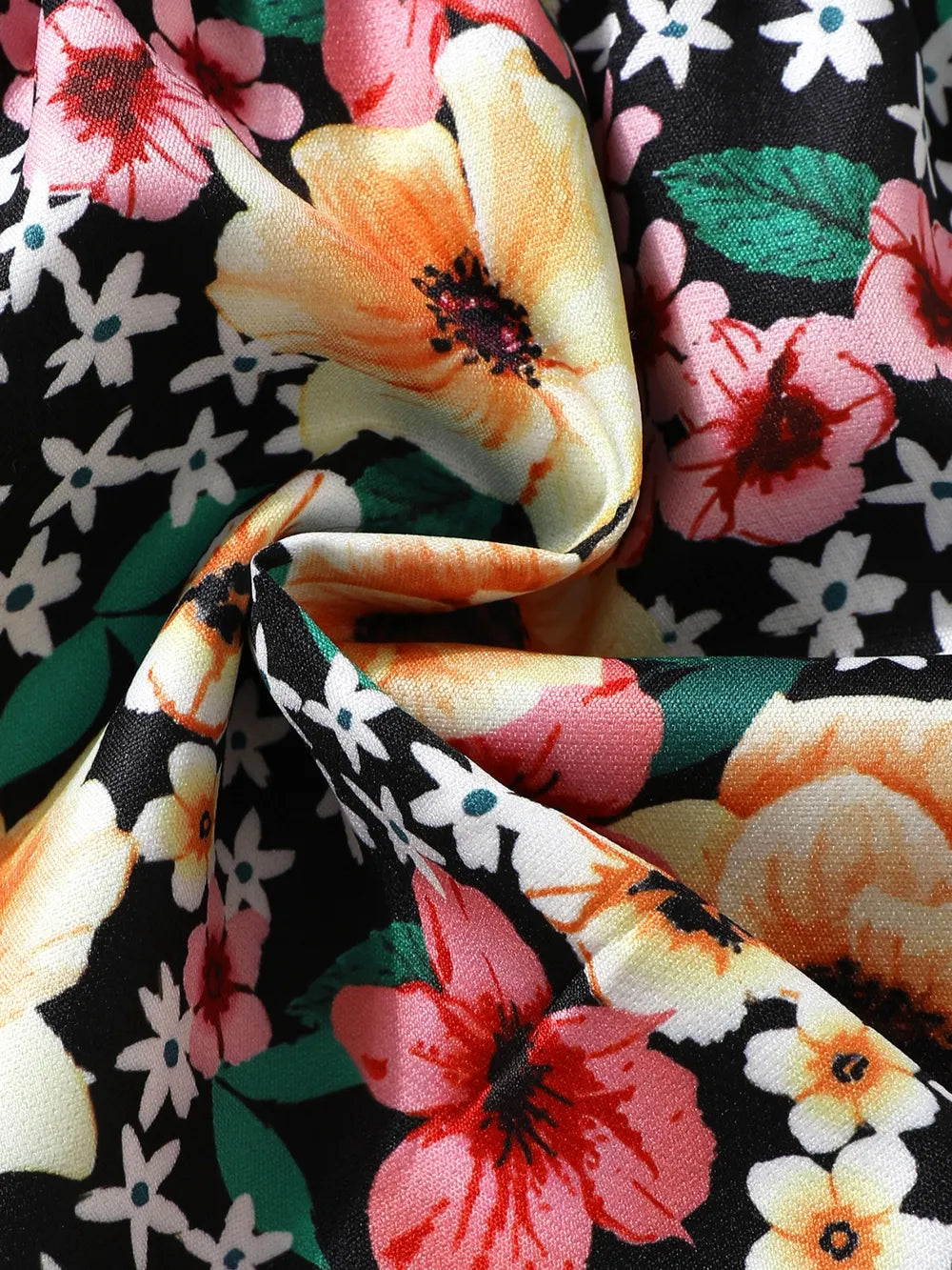 Close-up of floral fabric with bow-fold creases