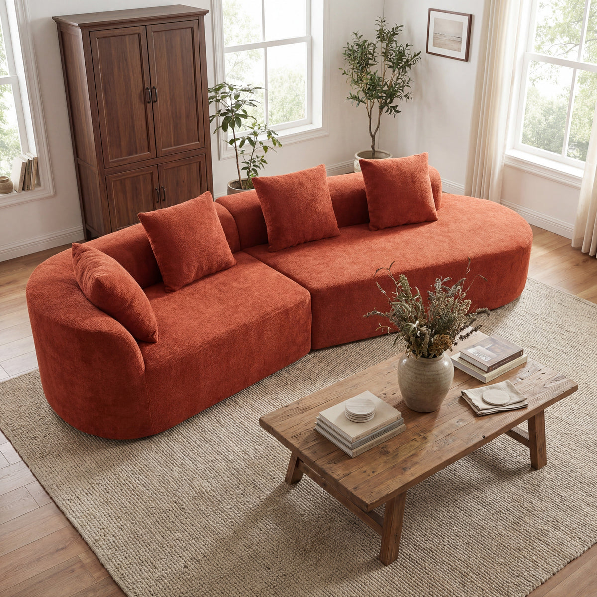 Orange curved sectional sofa with plush cushions and five matching square throw pillows