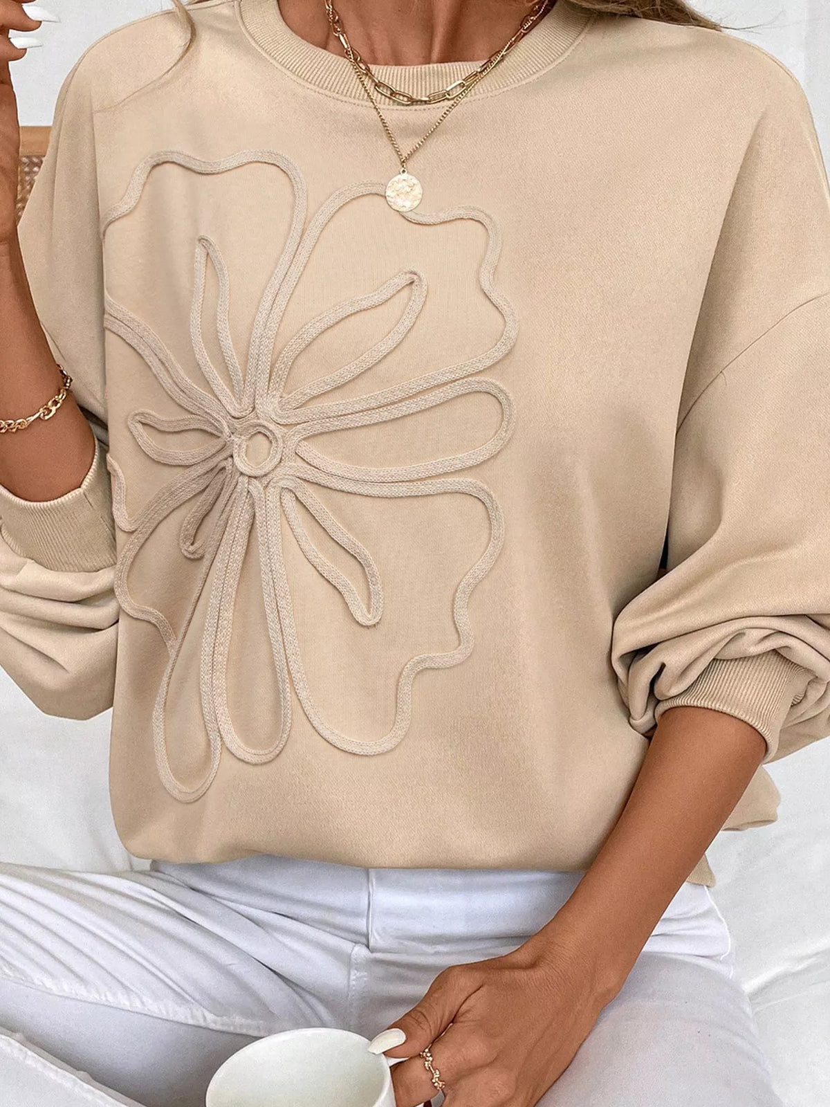 Beige drop-shoulder sweatshirt with large embroidered flower on front