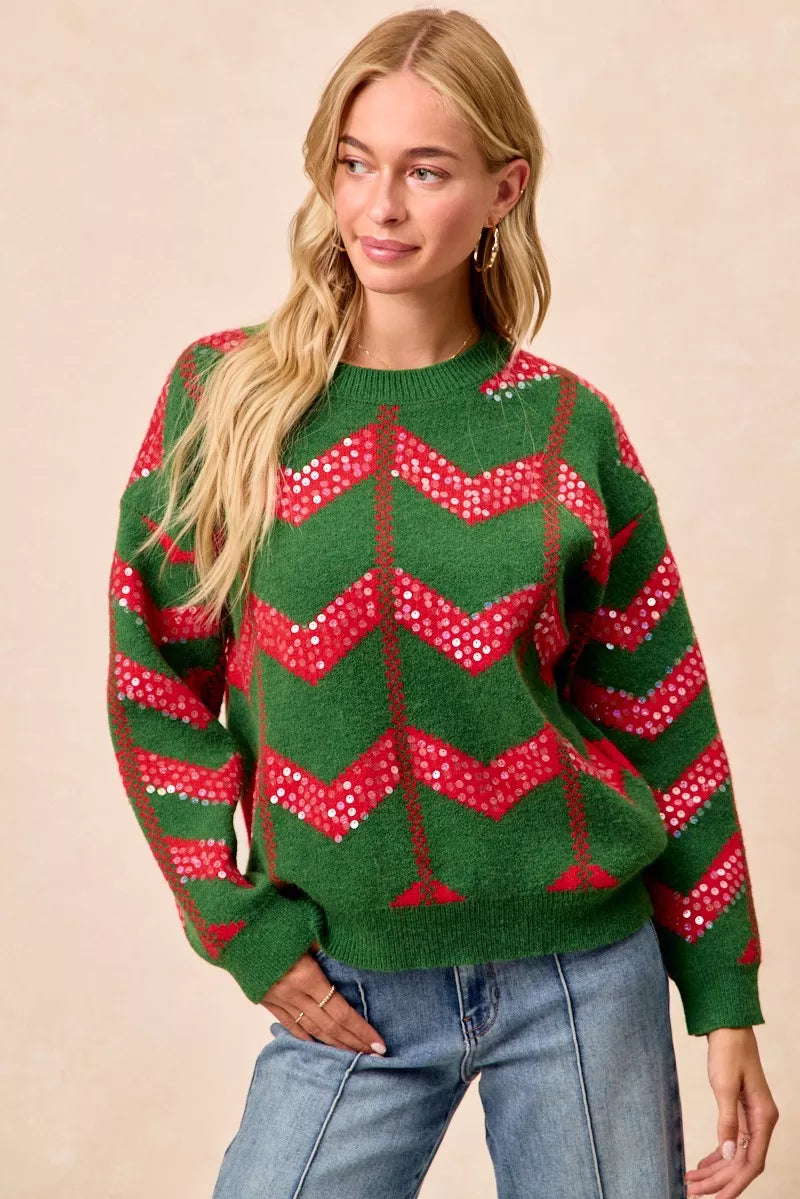 Green chevron knit sweater with red sequin zigzag pattern and long sleeves