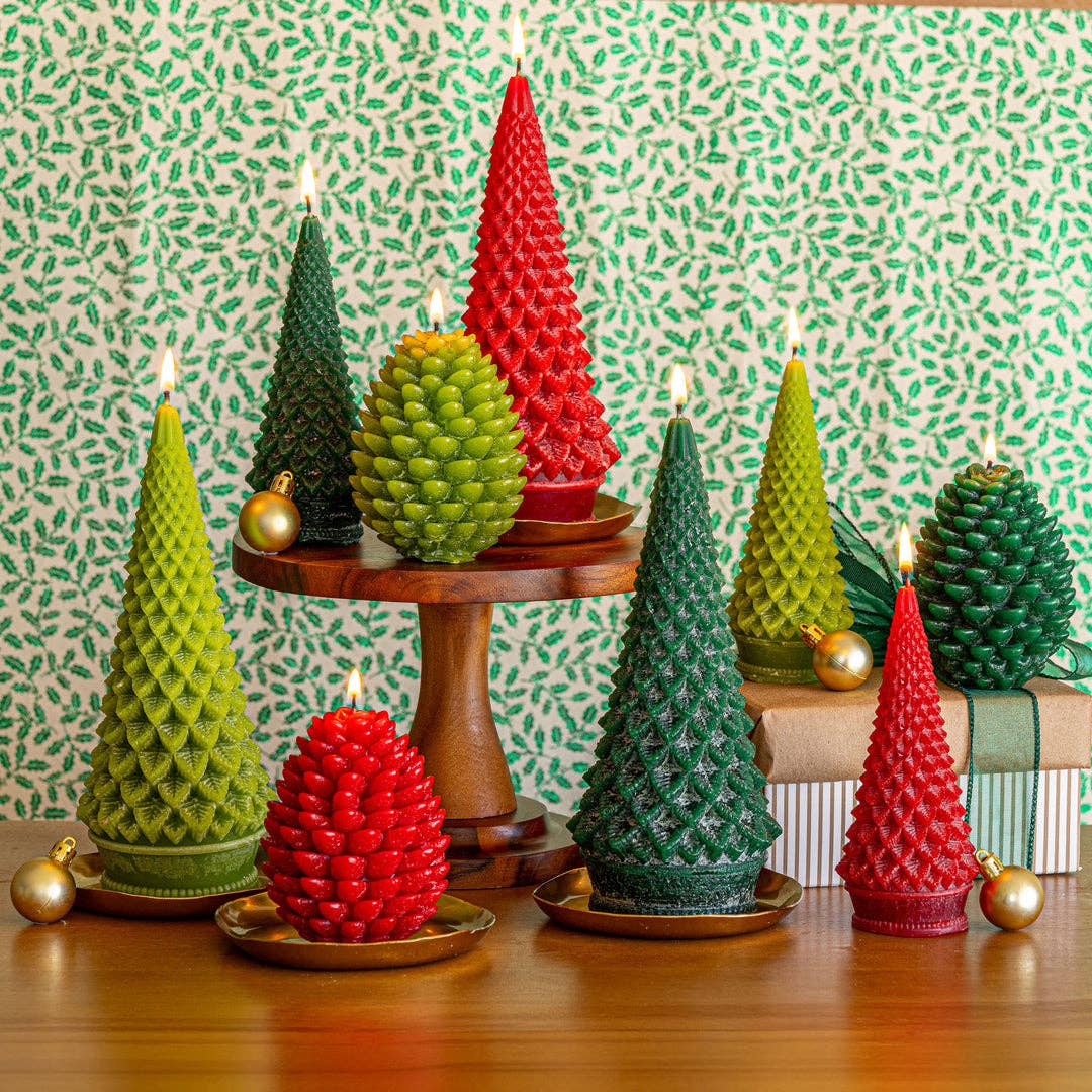 Multi-colored tree-shaped candle set on wooden stand with flames and gold ornaments