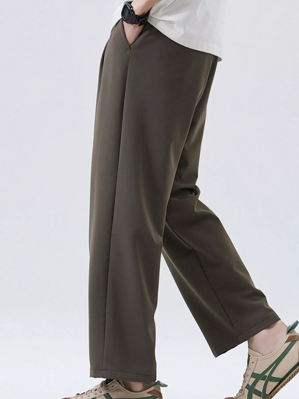 Dark brown loose-fit casual pants with full-length legs and cuffed hem