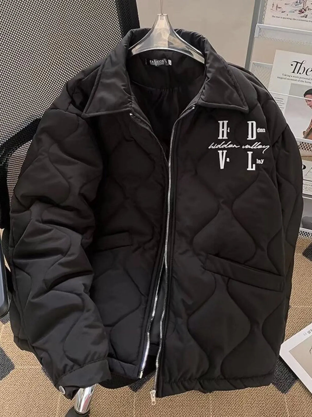 Men's quilted black zip-up jacket with stand collar and front logo embroidery