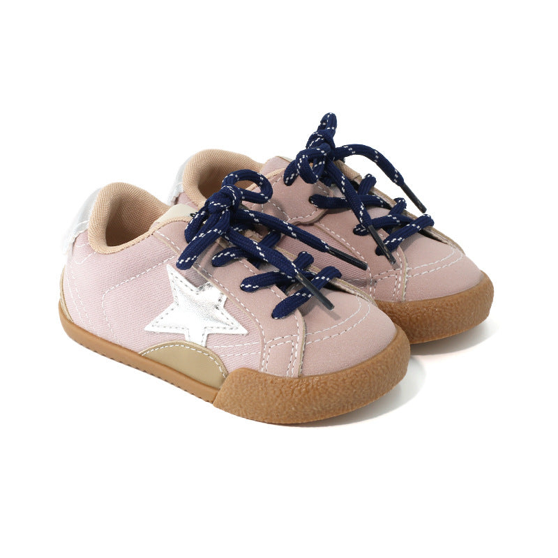 Girls sneakers in light pink with navy laces, star applique, and tan sole