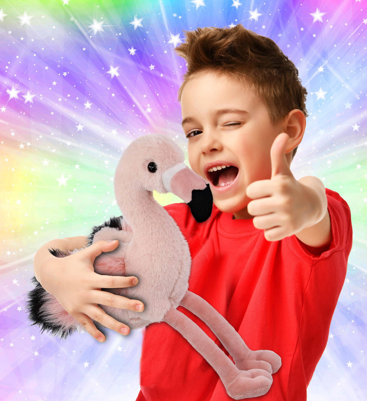 Flamingo plush toy held by a child; light-pink plush with black beak and long legs