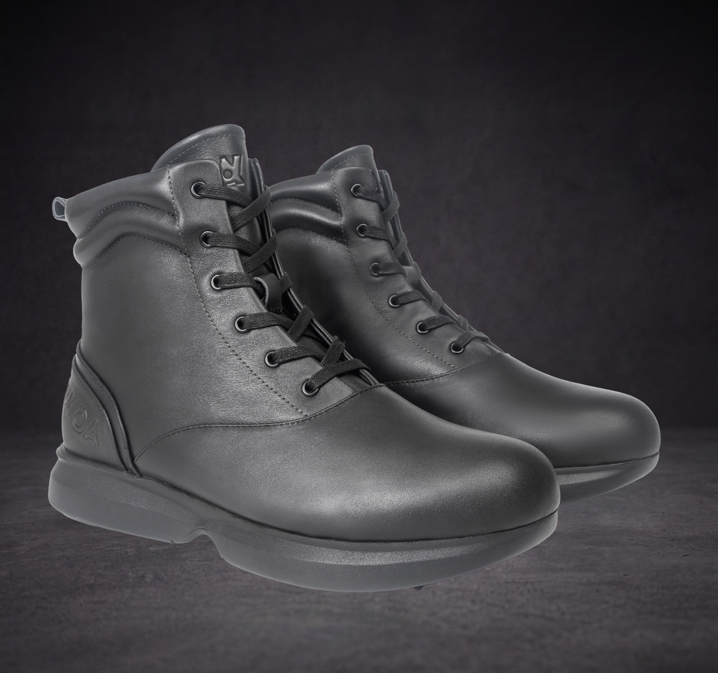 Pair of WOA lace-up ankle boots shown front three-quarter with thick rubber sole