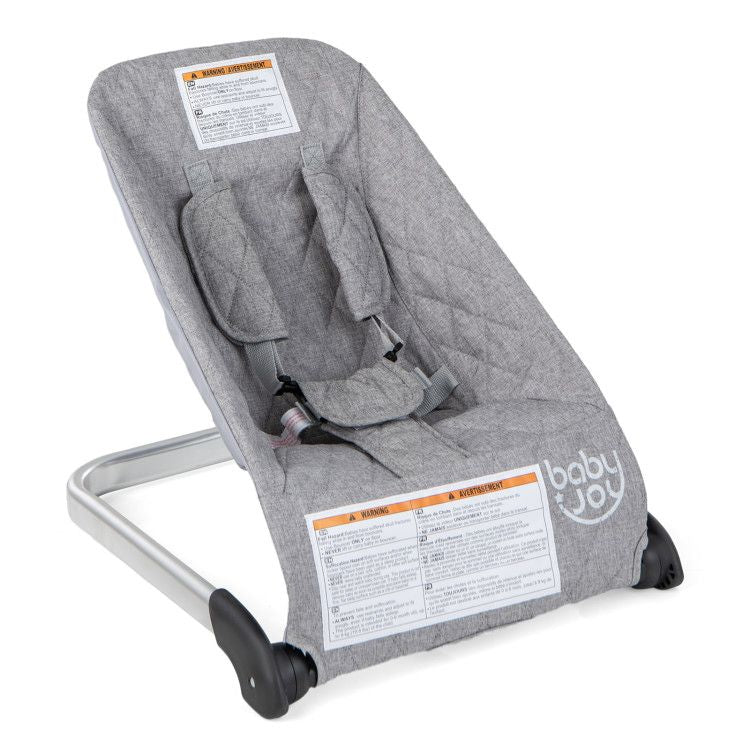 Gray baby bouncer seat with padded insert and 5-point harness, reclined view