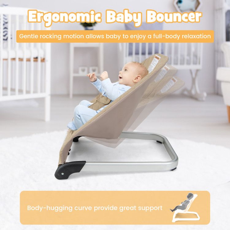 Baby bouncer seat with light beige padded seat and black rocker base, baby reclining