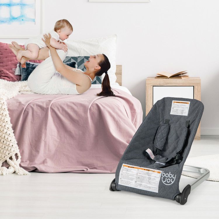 Baby bouncer seat with light gray fabric seat and aluminum metal frame, foldable base