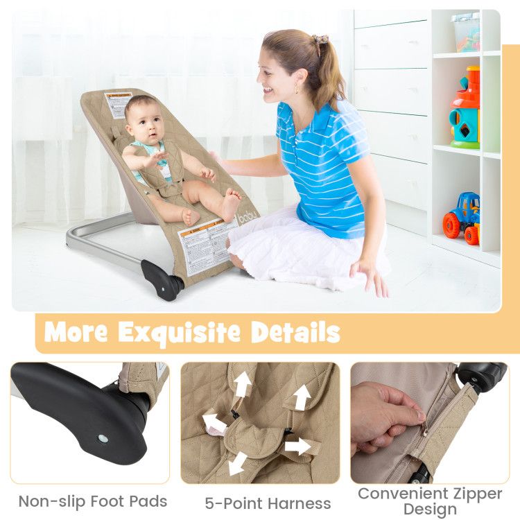 Baby bouncer seat with light beige cover featuring non-slip foot pads and 5-point harness