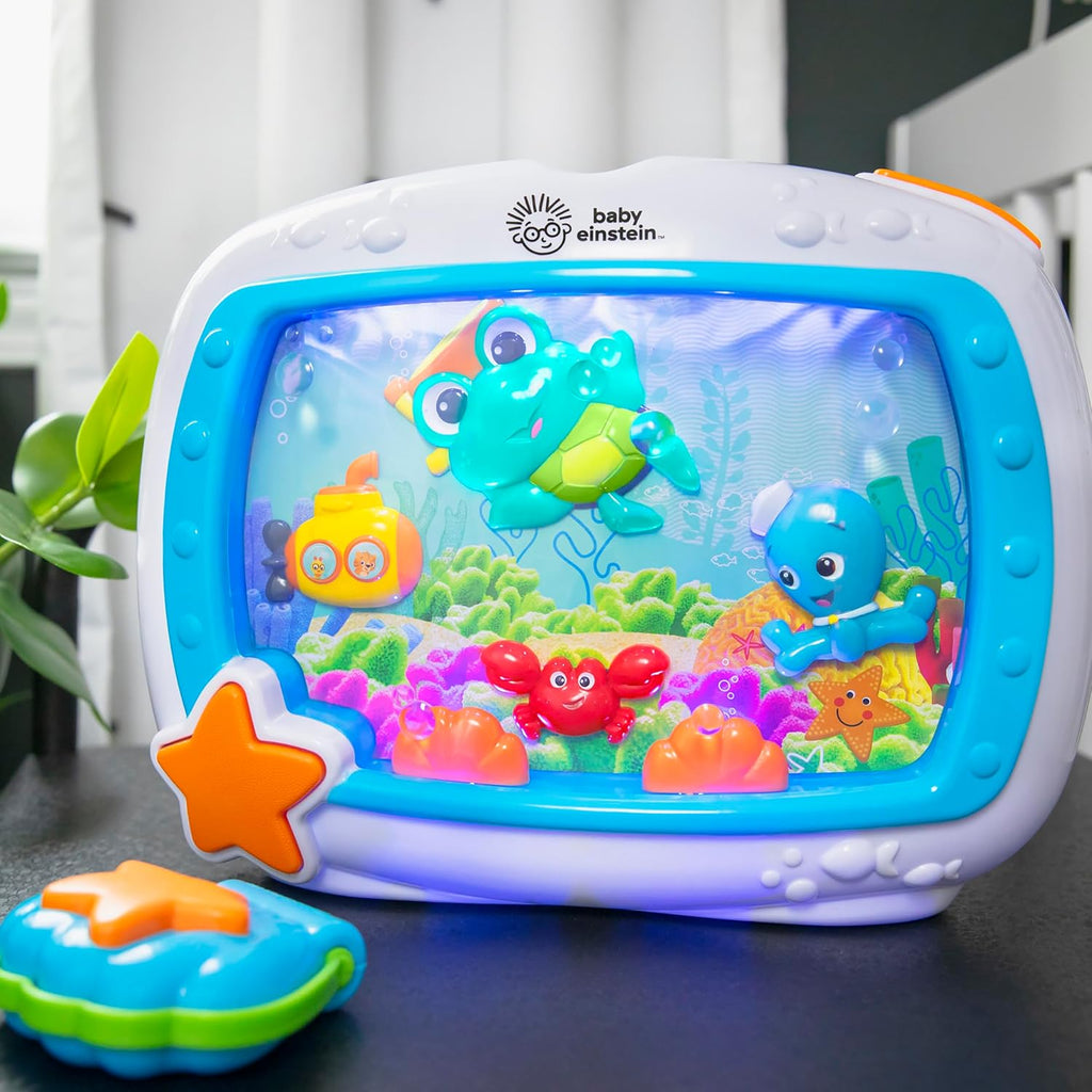 Close-up of blue ocean-screen crib sound machine with orange star control