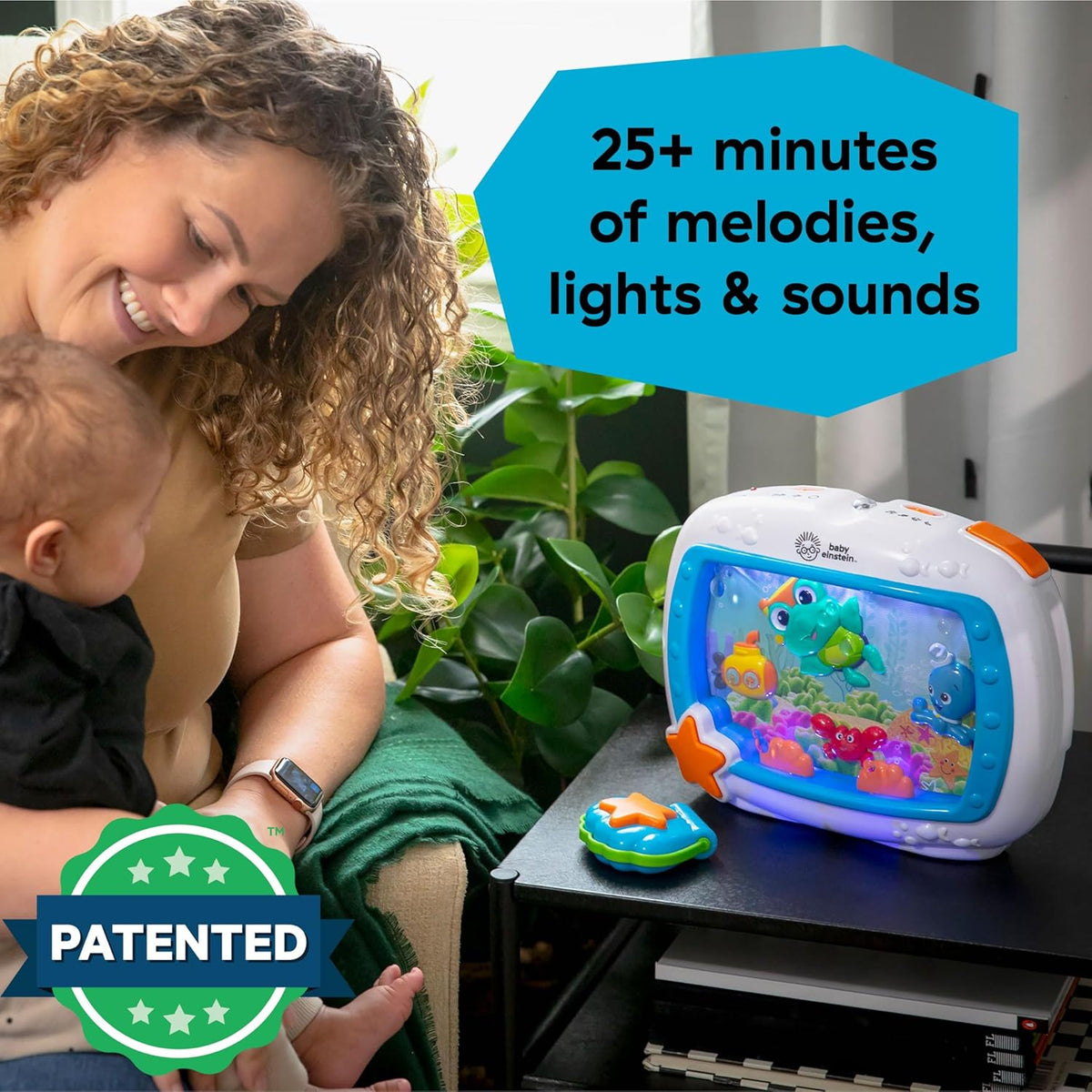 Baby Einstein sea-themed musical crib toy on a surface with a small star controller