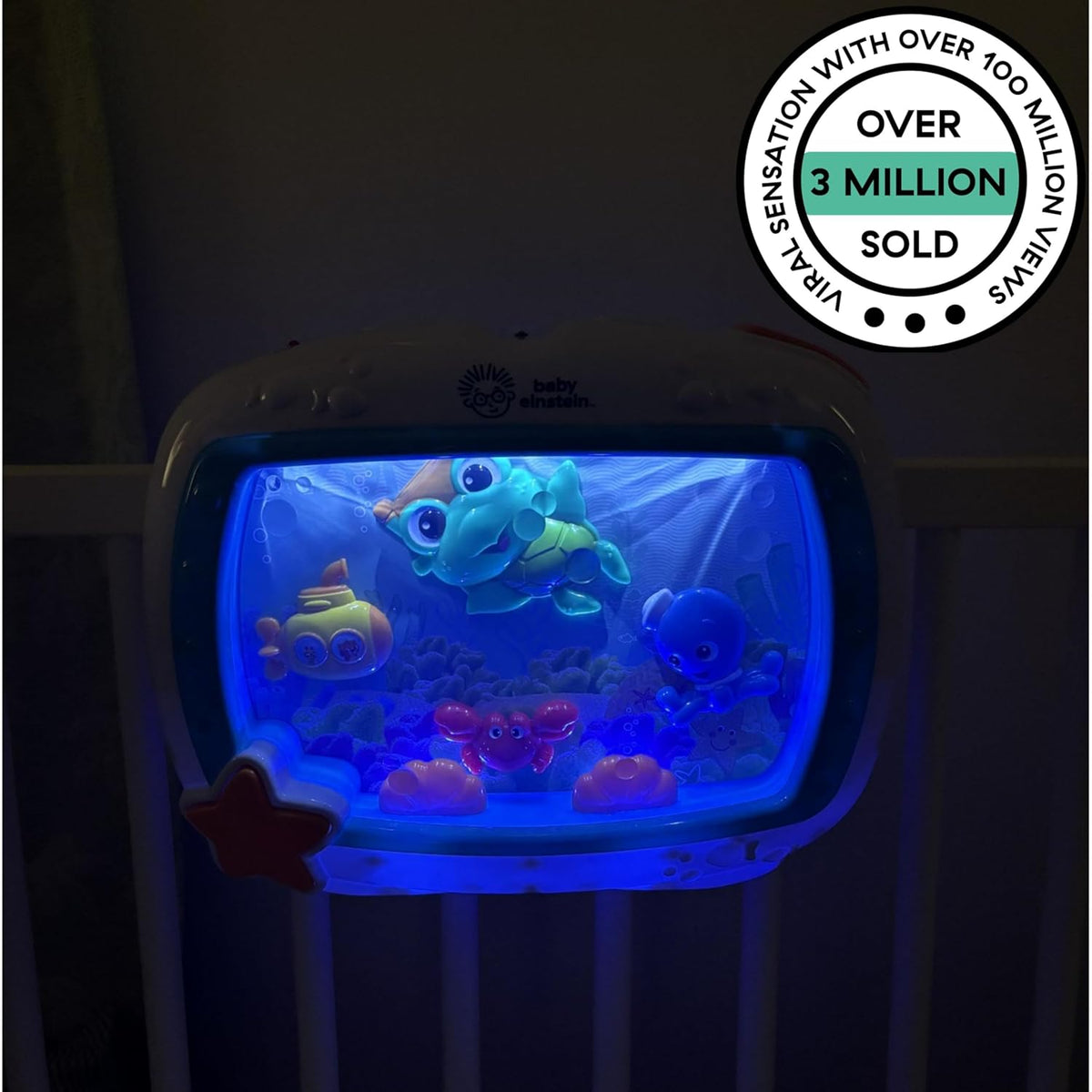 Baby Einstein sea-themed crib toy glowing blue with fish characters inside the screen