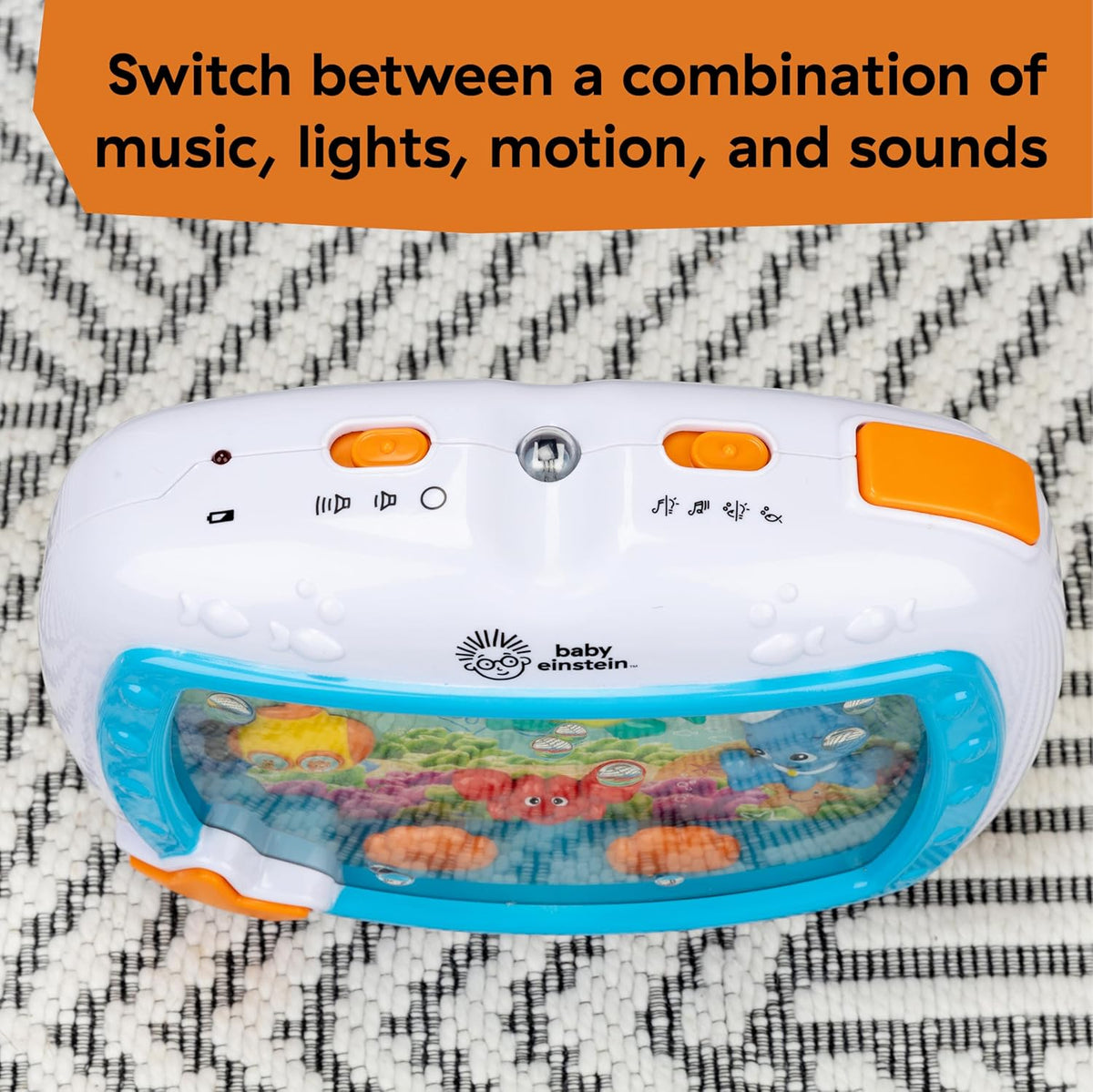 Baby Einstein crib toy front panel close-up with orange controls and blue aquarium window