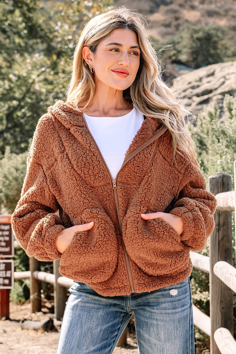 Brown sherpa fleece zip-up hooded jacket with front zipper and kangaroo pockets