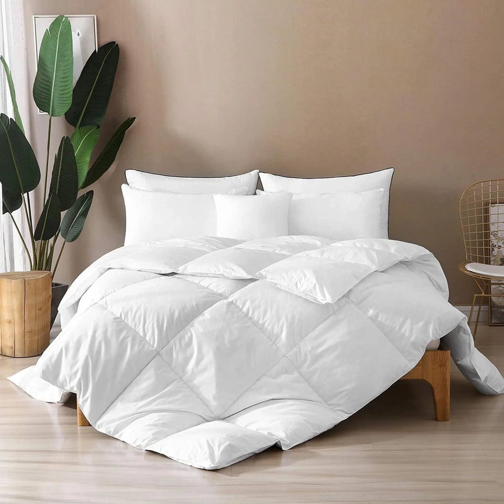 White duvet comforter draped on a bed, quilted baffle construction