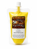 Yellow squeezable wax melt pouch with white screw cap and selected scent label