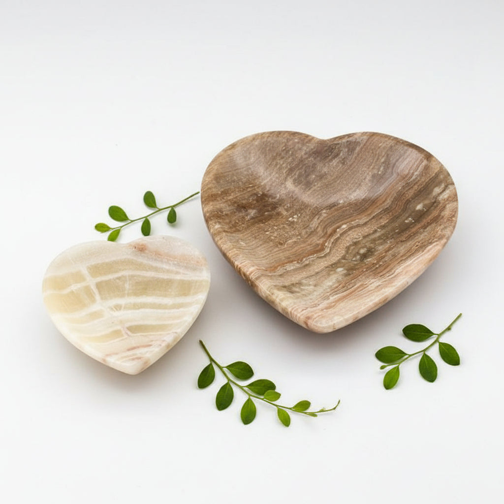 Heart-shaped stone jewelry dish with brown and cream banded pattern