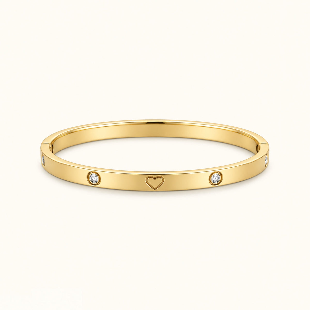 Gold-tone heart bangle bracelet with two round diamond-like stones