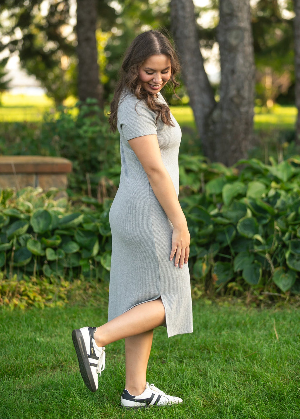 Gray ribbed t-shirt dress with crew neck, short sleeves, and front slit detail.