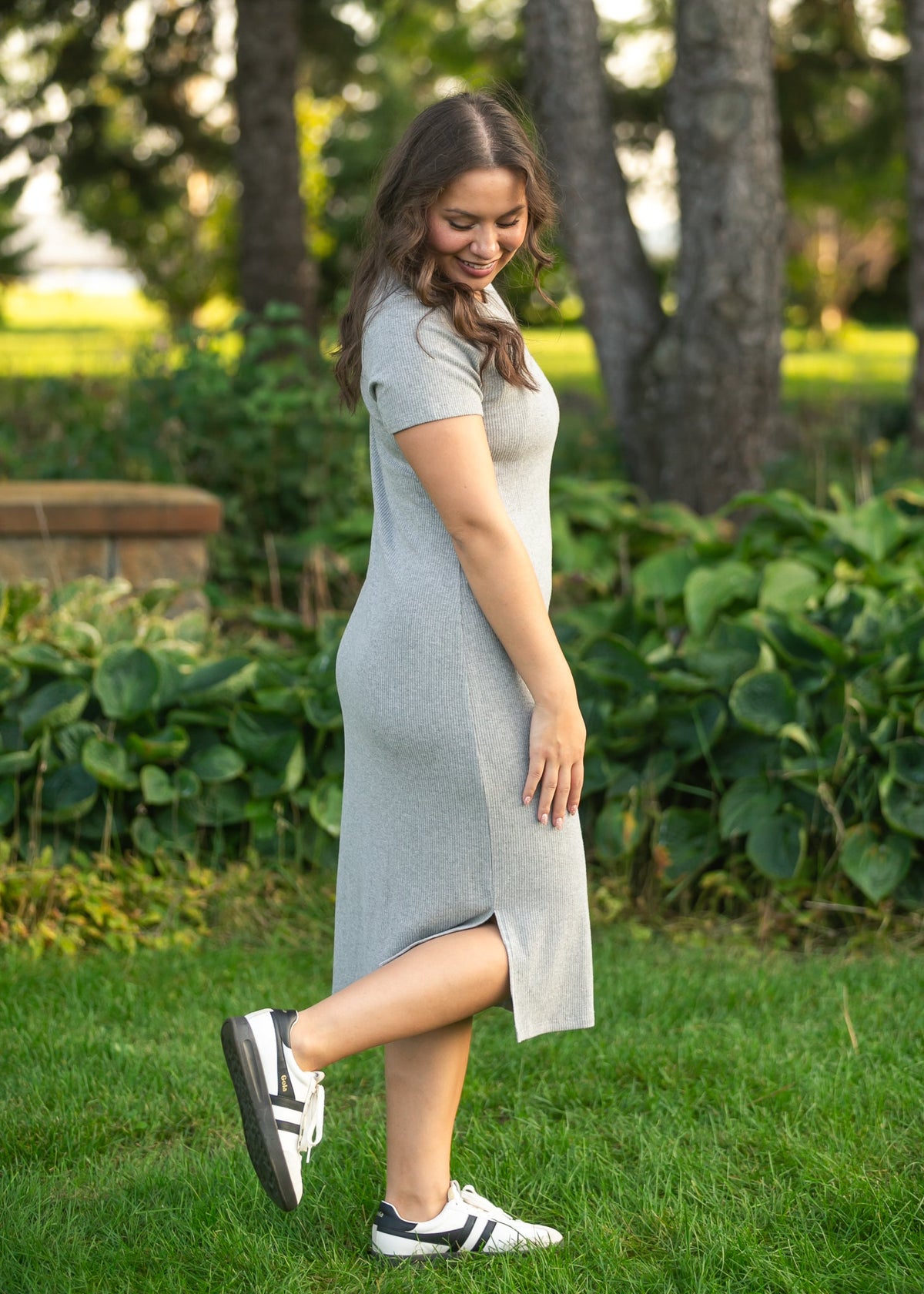 Gray ribbed t-shirt dress with crew neck, short sleeves, and front slit detail.