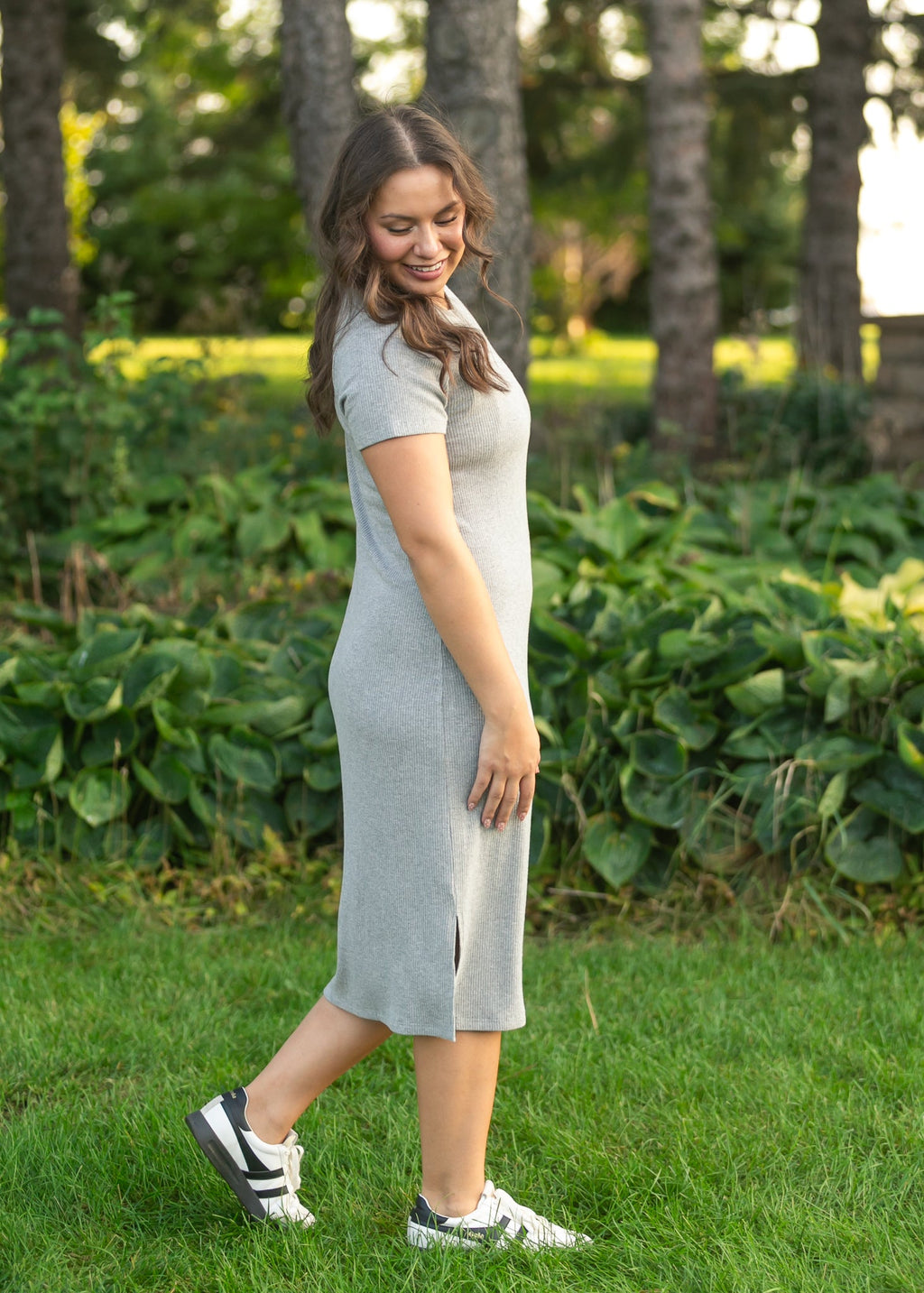 Gray ribbed t-shirt dress with crew neck, short sleeves, and front slit at hem.