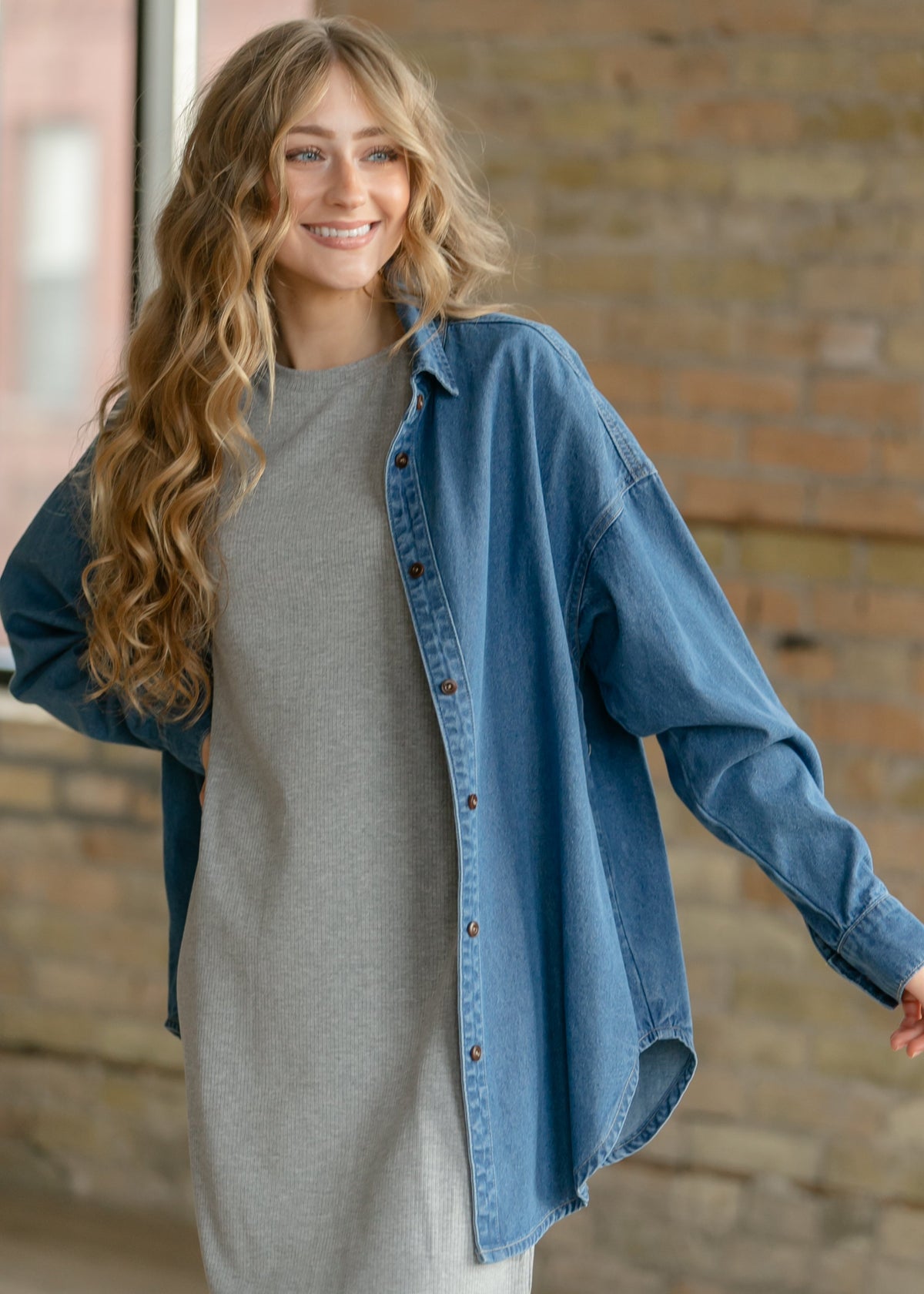 Gray ribbed t-shirt dress with crew neck and short sleeves, worn under open denim jacket.