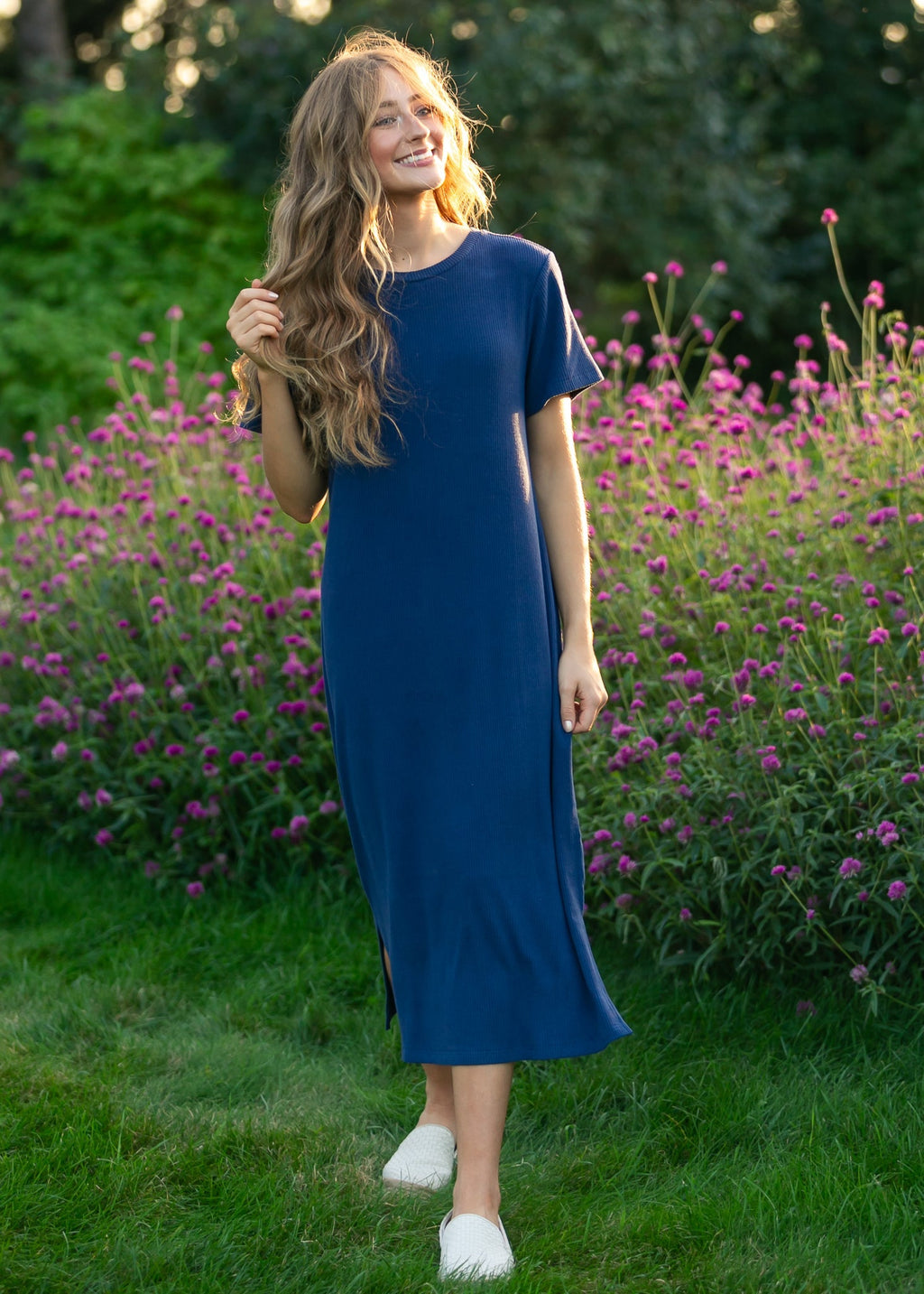 Navy ribbed t-shirt midi dress with short sleeves and crew neckline, straight hem.