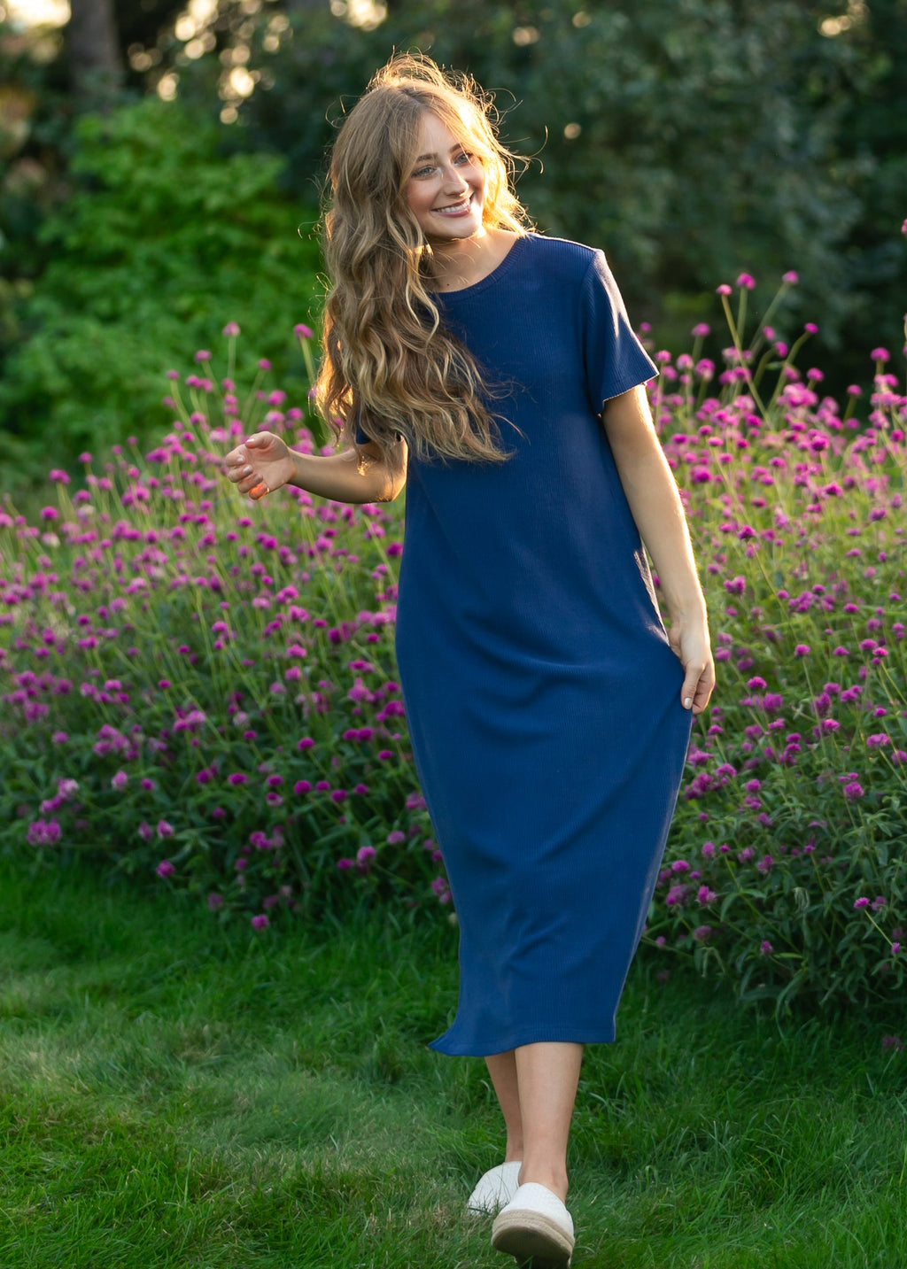 Navy t-shirt midi dress with short sleeves, crew neckline, and side-to-knee length.