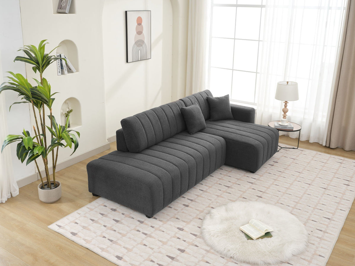 Dark gray sectional sofa with chaise, chaise cushion and tufted back profile