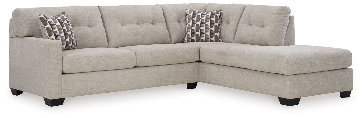 Light gray sectional sofa with corner chaise and three back cushions