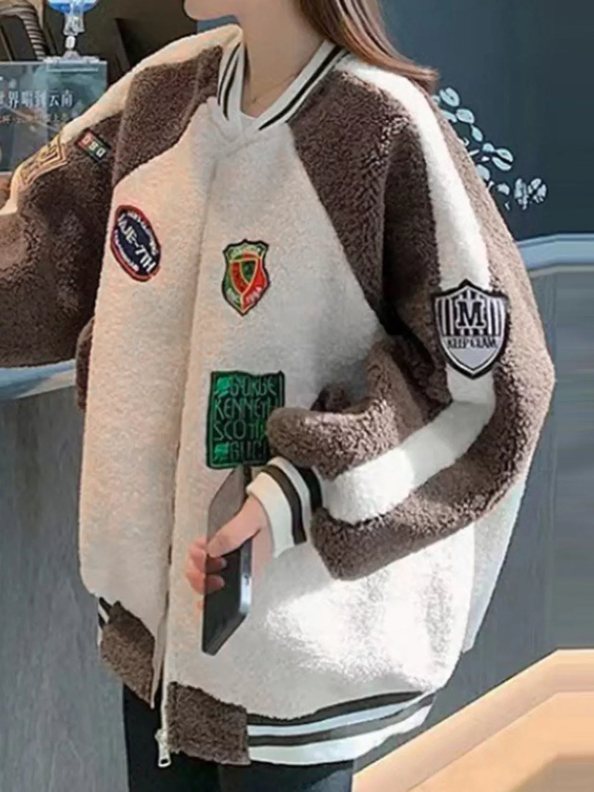 Khaki and white fleece zip-up jacket with front zipper, raglan sleeves, chest patches