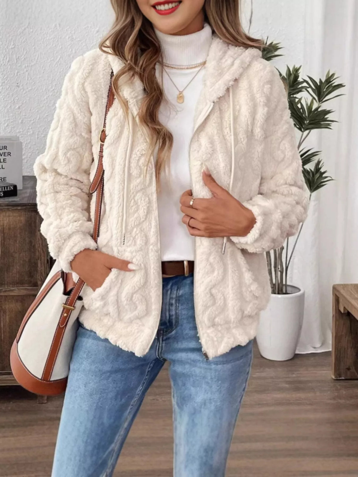 Ivory fleece zip-up hoodie with drawstring hood, front view with open neckline