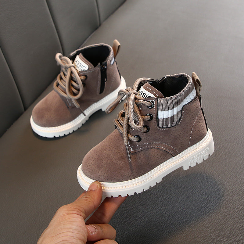 Taupe lace-up ankle boots with white striped collar and white rugged sole