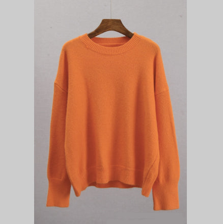 Orange crew-neck knit sweater, loose fit, long sleeves, ribbed cuffs and hem