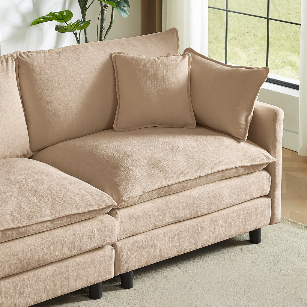 Beige upholstered sofa with two back pillows, black legs, and wide seat cushion.