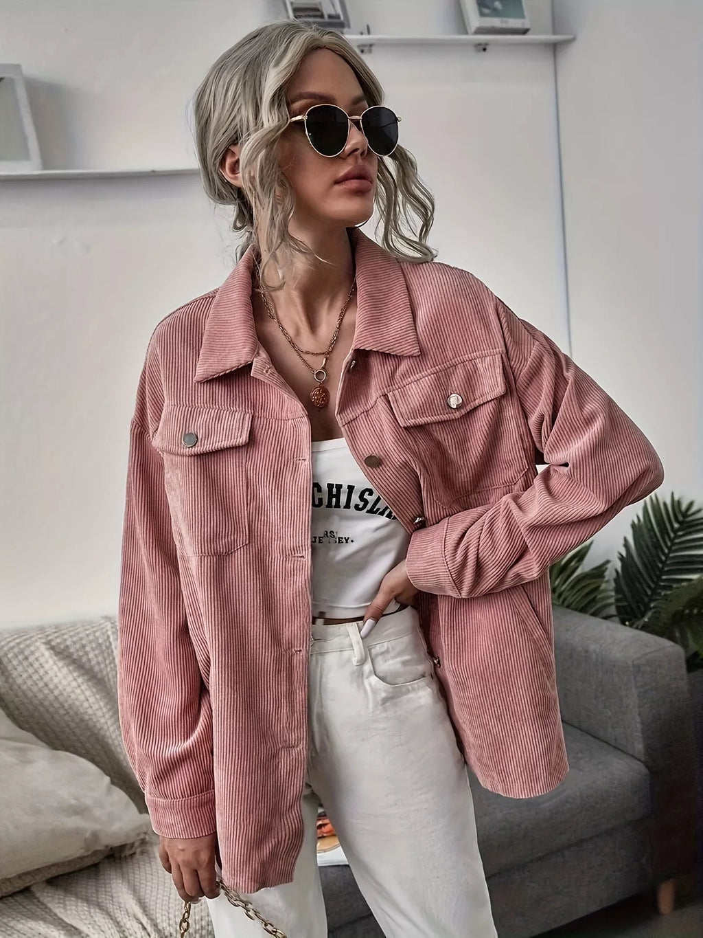 Pink corduroy button-up shacket with pointed collar and flap chest pockets