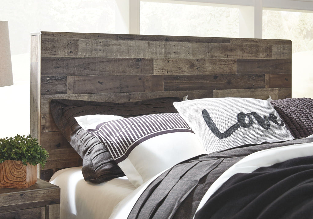 Youth panel bed with rustic dark wood headboard and striped bedding