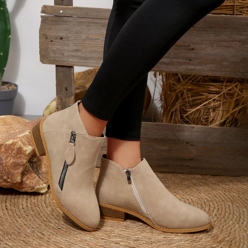 Light beige suede block-heel ankle boots with side zipper and cushioned collar