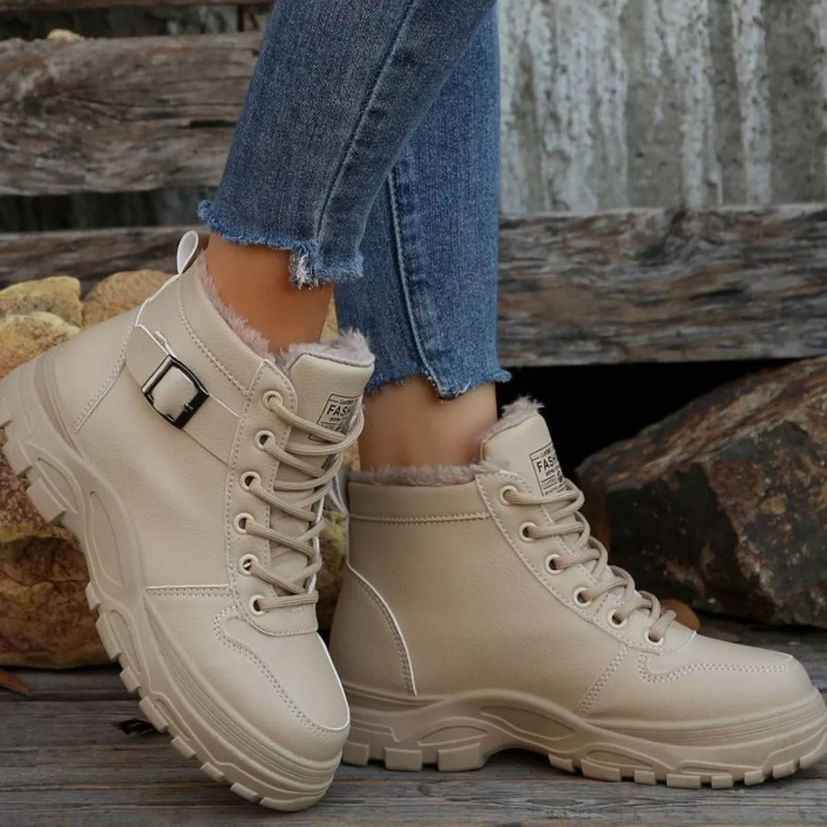 Beige warm-lined ankle boots with buckle strap, lace-up closure, rugged tread sole