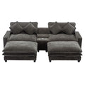 Dark gray sectional sofa with removable ottomans and four throw pillows